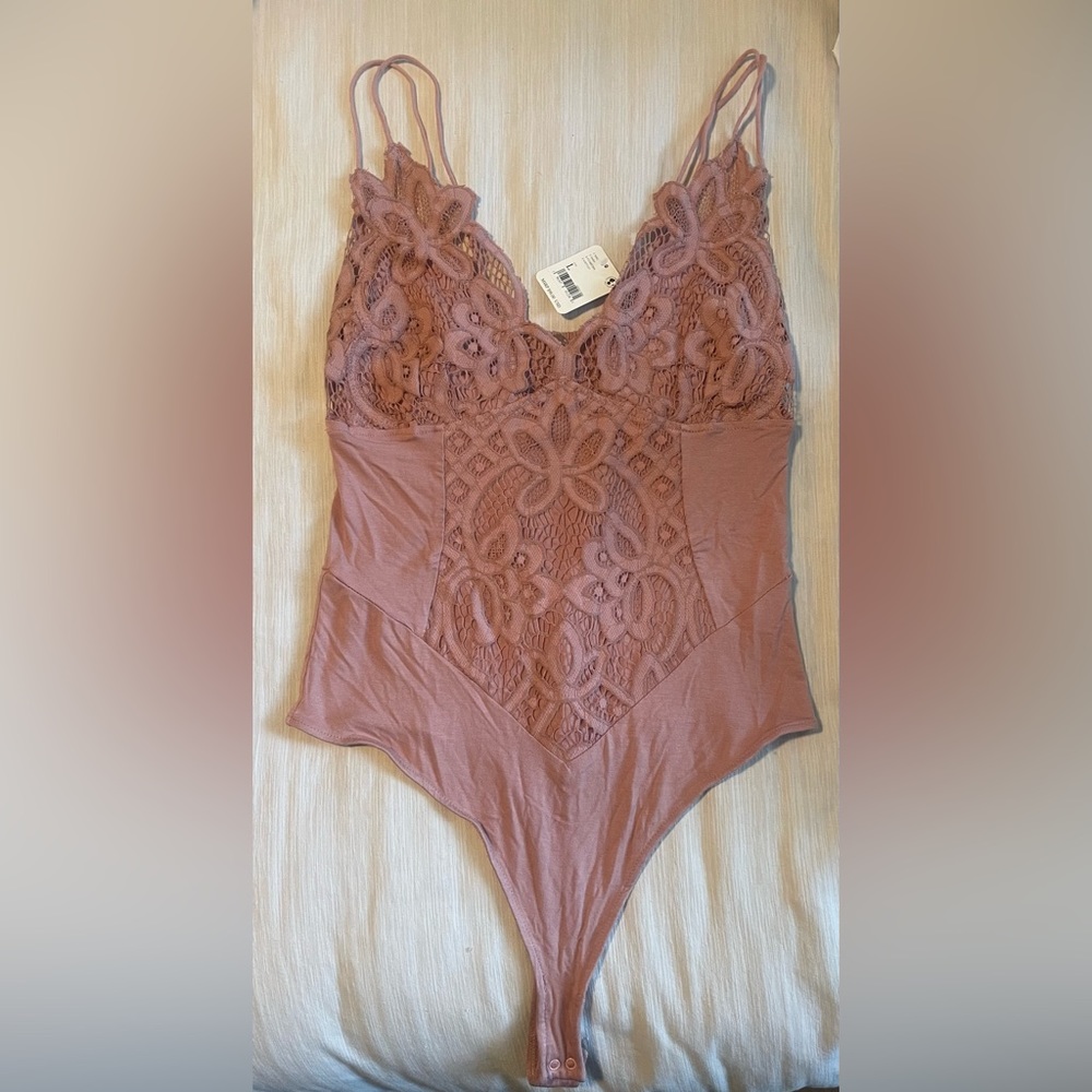 Pink Free People body suit with tags